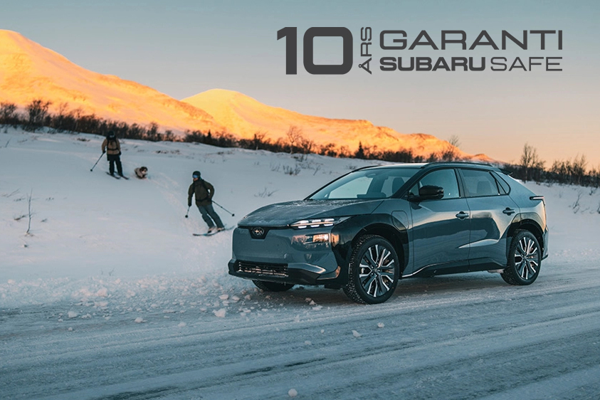 Subaru Safe - 10 års Trygghetsgaranti. BIld på nya Solterra med skidåkare i bakgrunden.